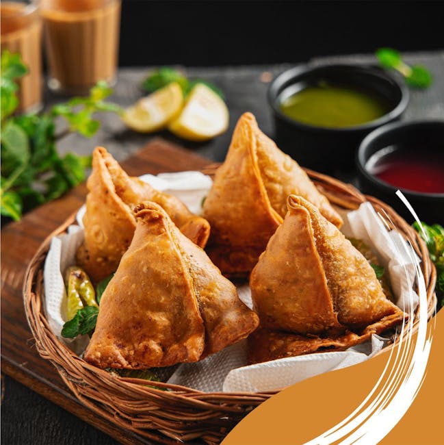 Crispy samosas served with chutneys